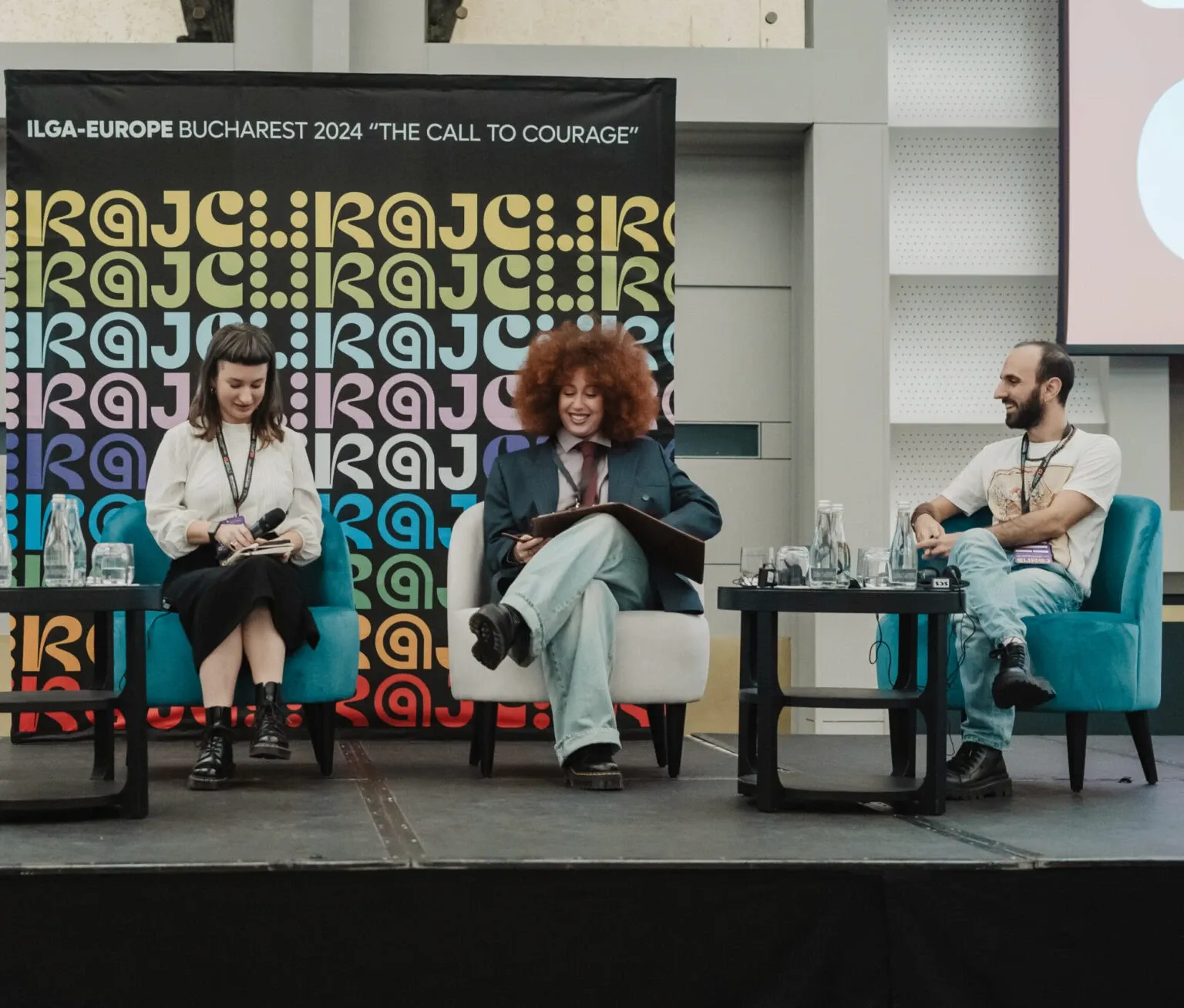 Curaj conference identity on stage backdrop at ILGA-Europe Bucharest 2024 The Call to Courage event. By WeGrow